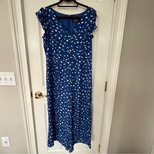 Lulu’s flutter sleeve cropped romper in blue flower pattern.